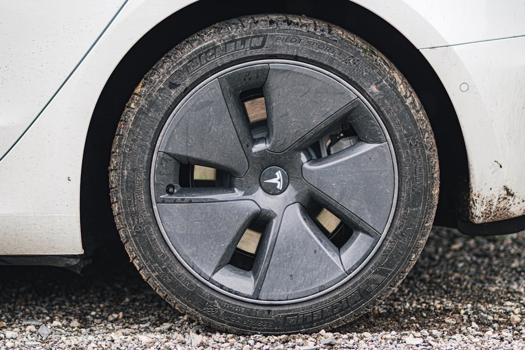 Tesla Model 3 wheel showing brake disc and caliper