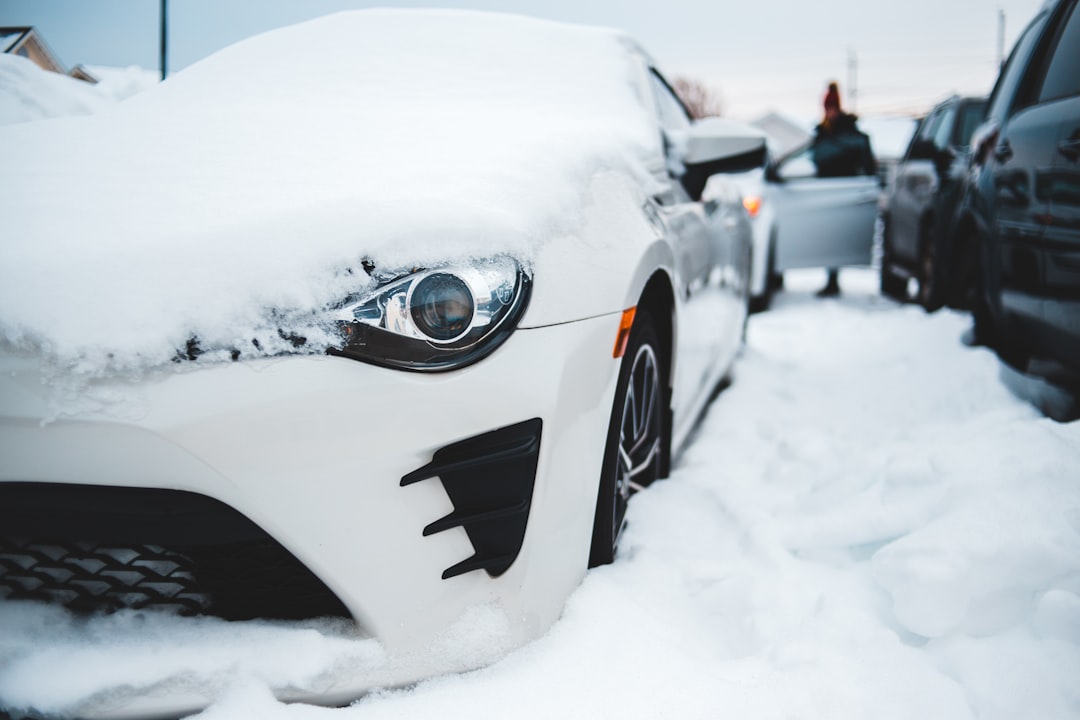 White vehicle covered in snow during winter